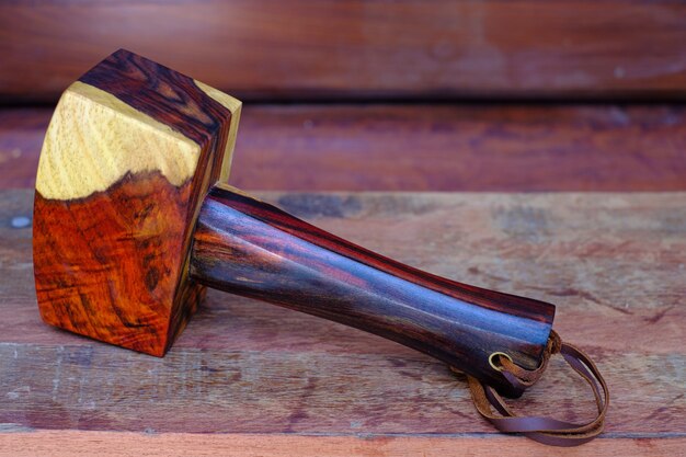 Mallet hammer wood made of rosewood and tool handmade of Thailand for use by a carpenter in the workshop on the old workbench