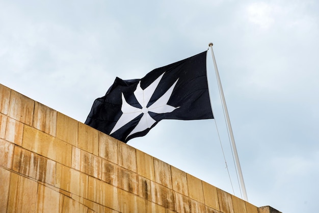 Premium Photo | Maltese cross on a flag