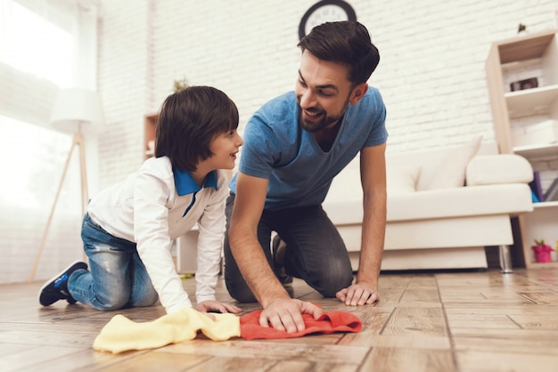 A man accustoms the boy to cleanliness.