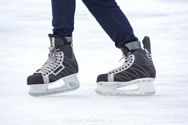 Man actively skates on an ice rink