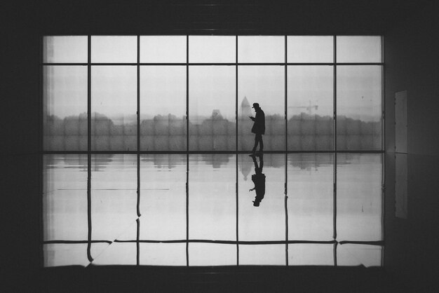 Photo man against glass window at centre pompidou-metz