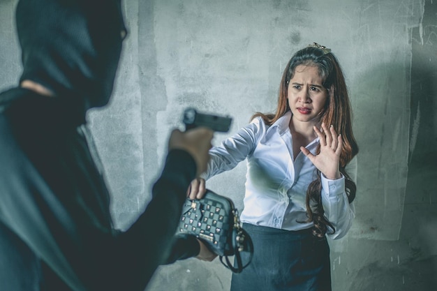 Man aiming gun on woman