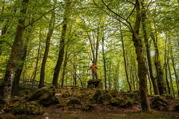 A man at the Aitzetako Txabala Dolmen in the Basque Country Errenteria Gipuzkoa