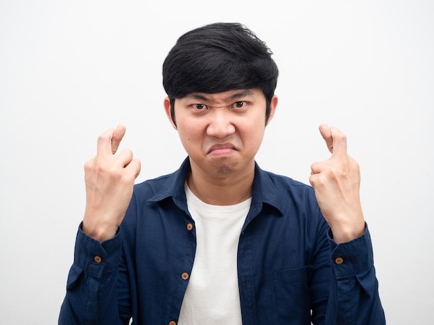 Photo man angry face corss finger portrait white background head shot,asian man not satisfied