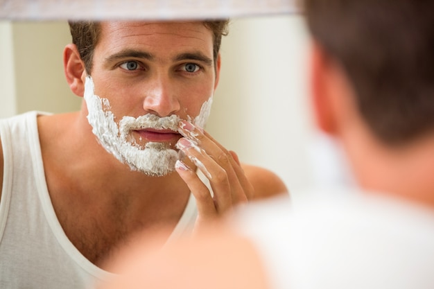 Man applying shaving foam