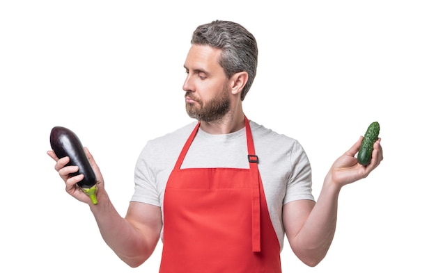 Man in apron with vegetables isolated on white