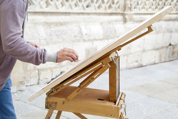 Man artist painting on the street