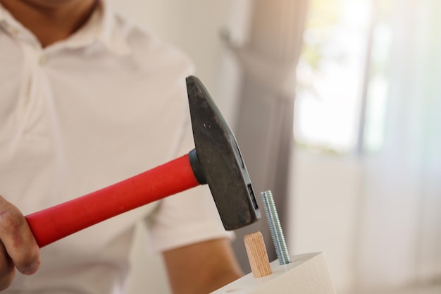 Man assembling furniture at home