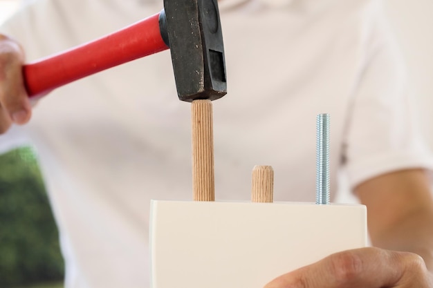 Man assembling furniture at home