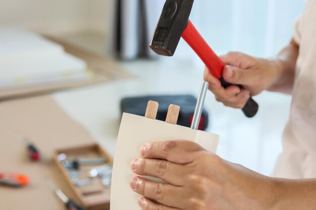 Man assembling furniture at home