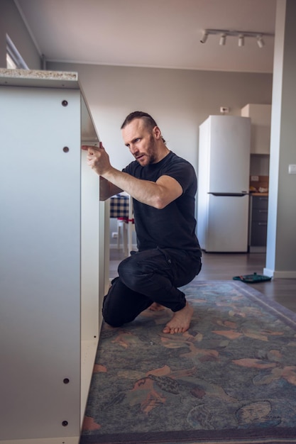 Man assembling furniture