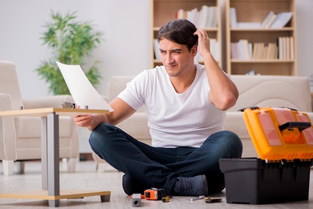 Man assembling shelf at home