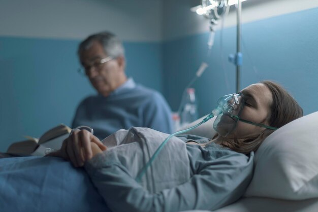 Man assisting a young woman at the hospital