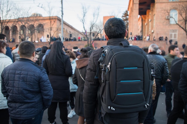 Man in backpack in street