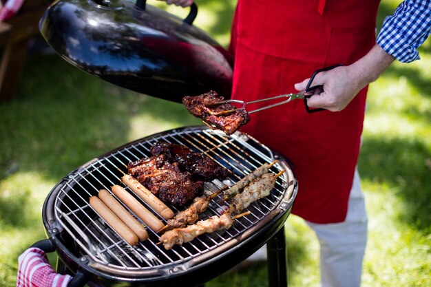 Man barbequing in the park