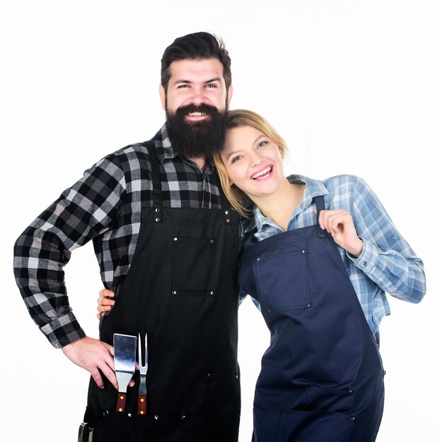 Man bearded guy and girl ready for barbecue white background. Picnic and barbecue. Backyard barbecue party. American food tradition. Cooking together. Couple in love getting ready for barbecue.