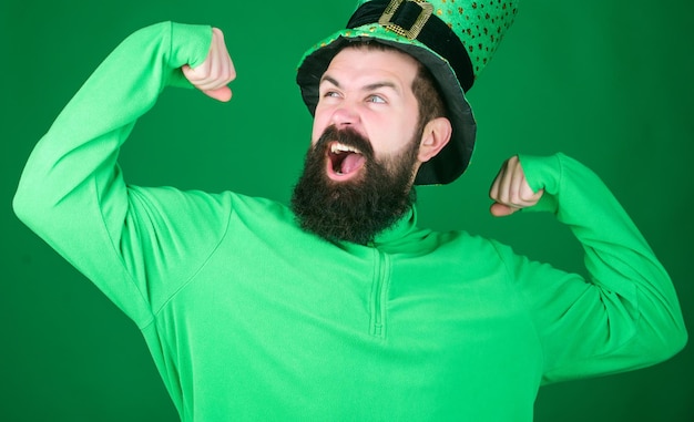 Man bearded hipster wear hat saint patricks day holiday green\
part of celebration happy patricks day st patricks day holiday\
known for parades shamrocks and all things irish global\
celebration