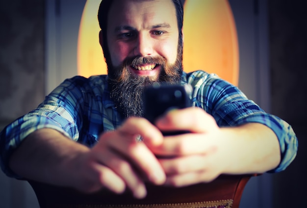 Man bearded look phone