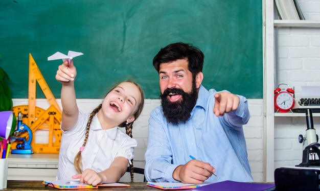 Man bearded pedagogue and pupil having fun Developing caring learners who are actively growing and achieving School learners leisure Creating a community of learners Teacher and schoolgirl