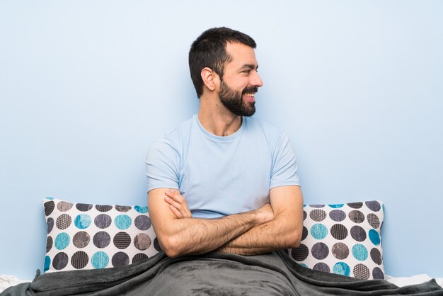 Man in bed in lateral position