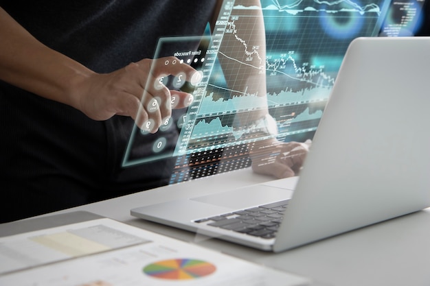 Man in black touching on futuristic virtual touch screen or augmented reality numeric keypad while entering security passcode to login to investment information analysis