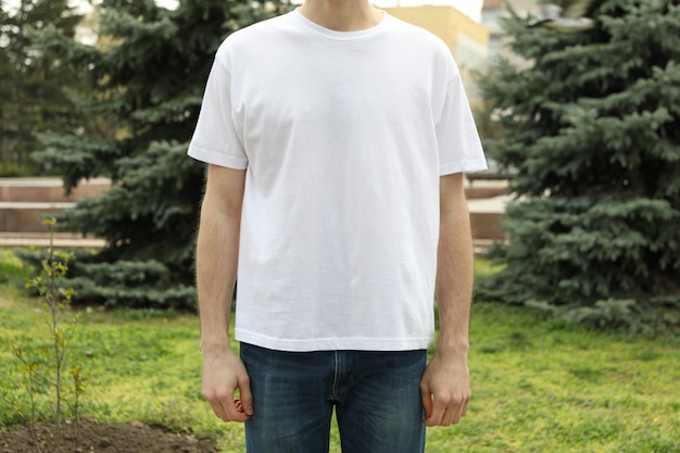 Man in blank white t-shirt. Outdoor photo