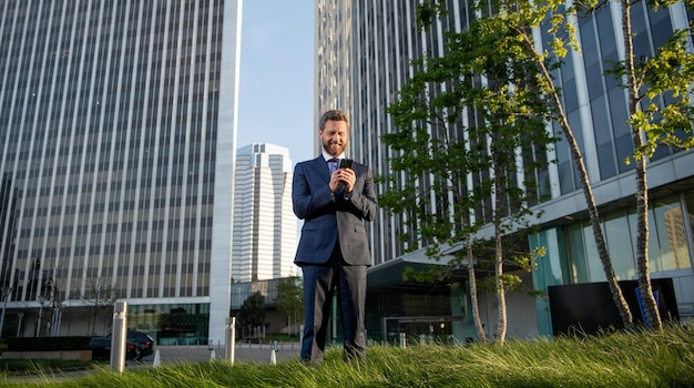 Man blogger use smartphone professional ceo working online typing and texting