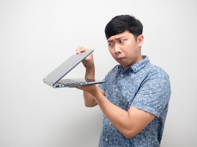 Man blue shirt half open laptop in hand gesture spying content