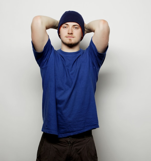 Man in blue t-shirt and blue hat.