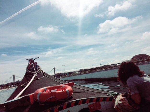 Man in boat against sky