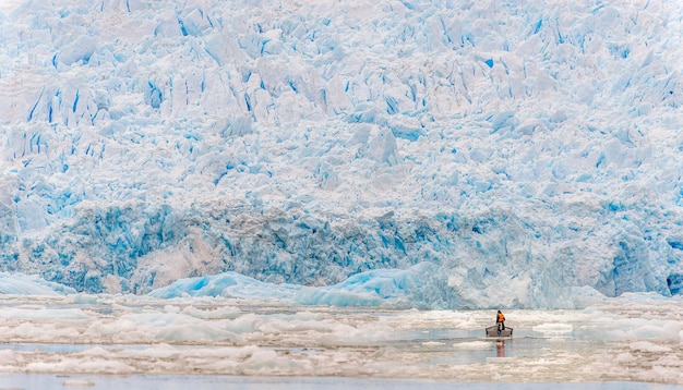 Man in boat on frozen sea