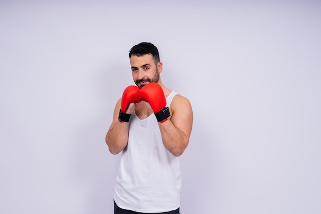 man boxer in red sport boxing gloves at studio copy space