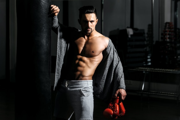 Man in boxing gloves with punching bag