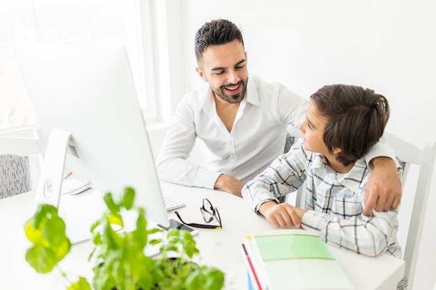 Man and boy on computer