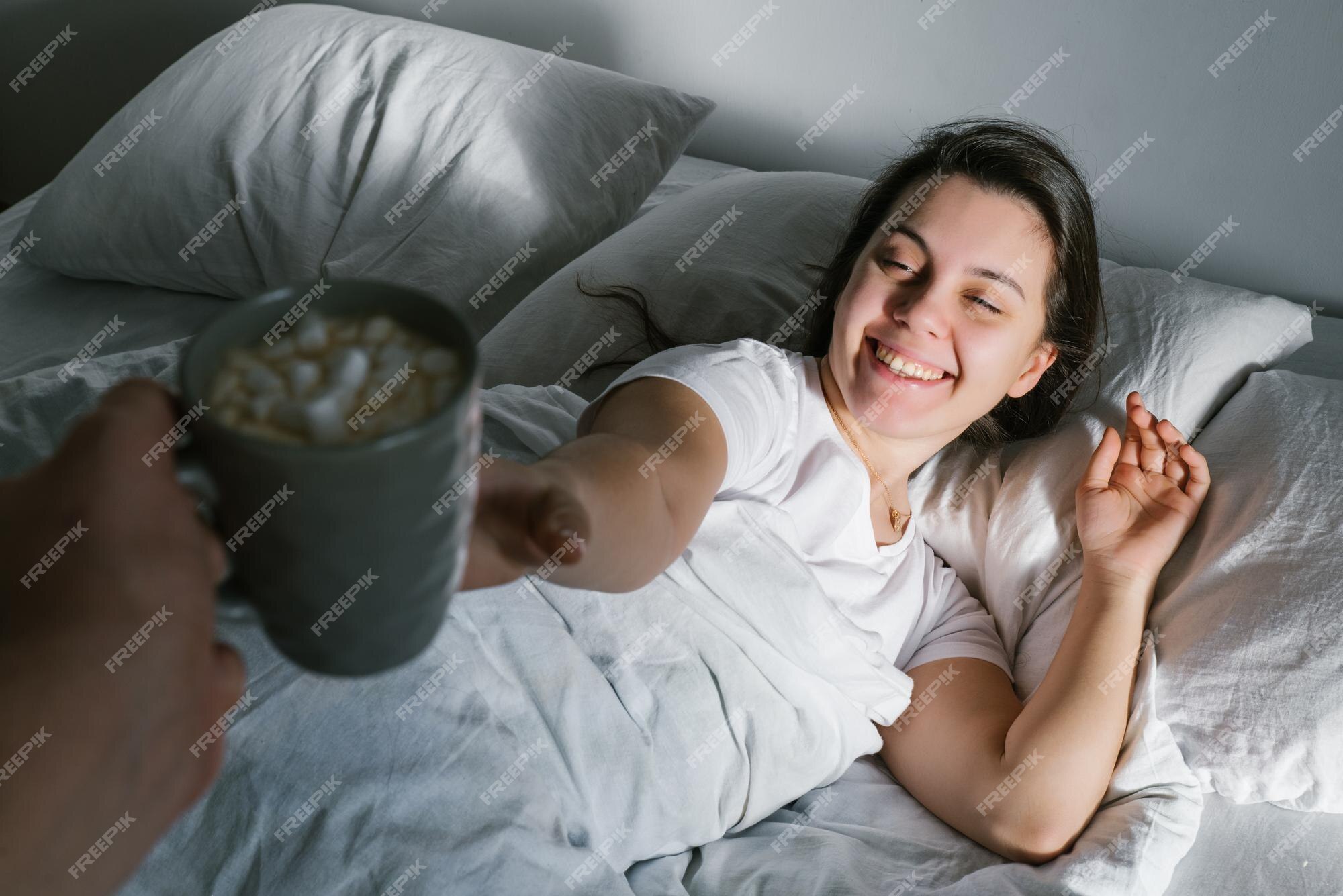 A Woman Sits On The Bed Beside A Face-down Man Coffee Mug by