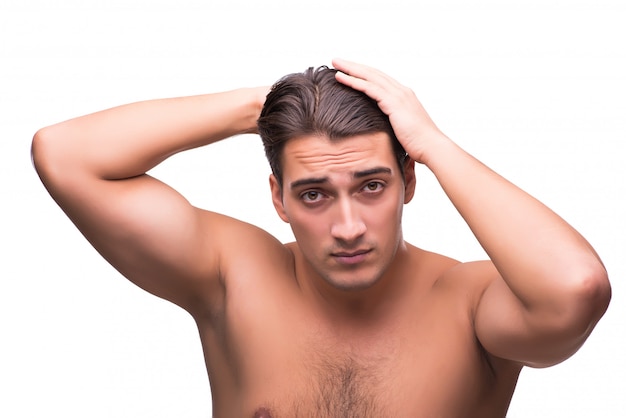 Man brushing his hair isolated on white