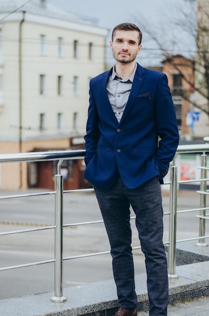 a man in a business suit against the background of the city