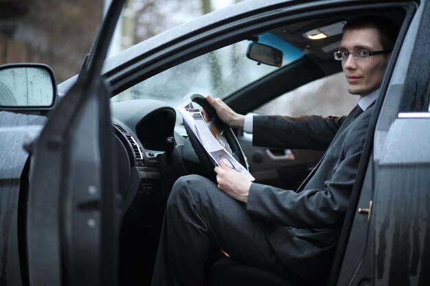 Man in a business suit in the car