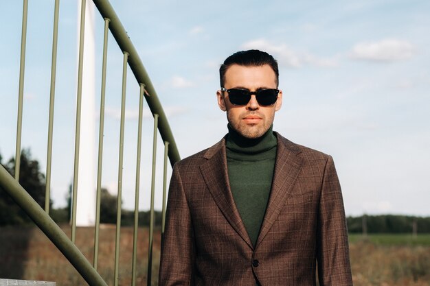 A man in a business suit posing