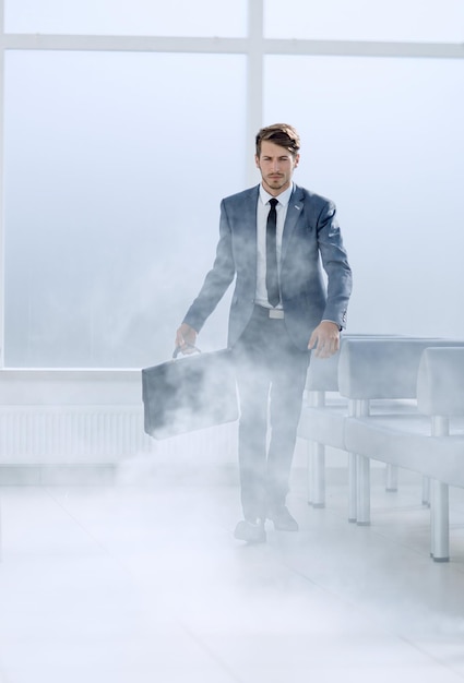 Man in a business suit in a smoky environment