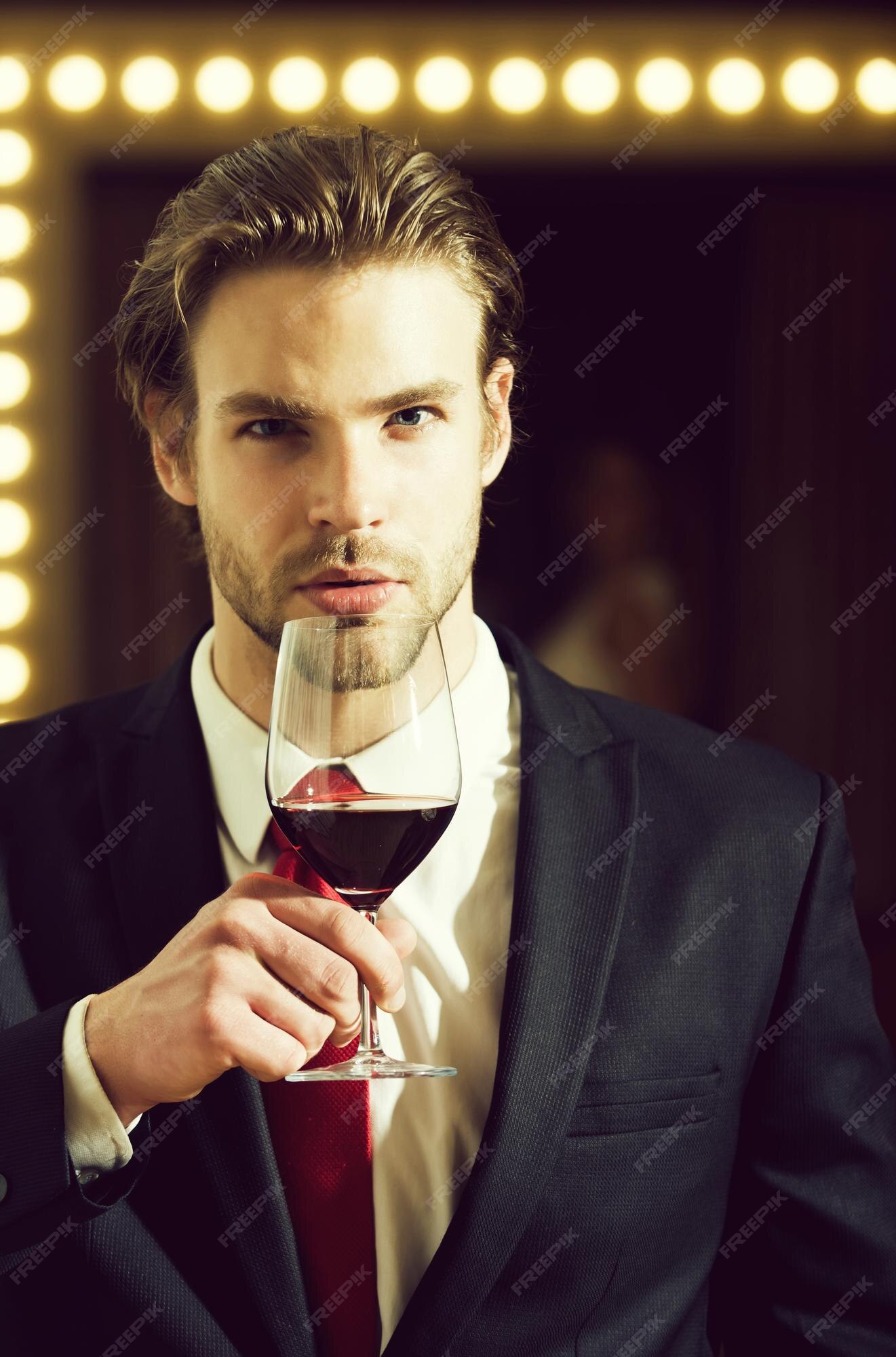 Premium Photo  Young man in formal outfit with red tie hold wine glass  near woman.