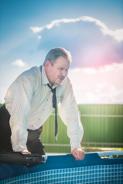 Man businessman in nature Sunny