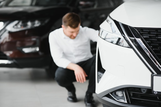 Man buying a car at a showroom