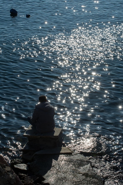 Man by the beach thinking contemplating Life changing decisions