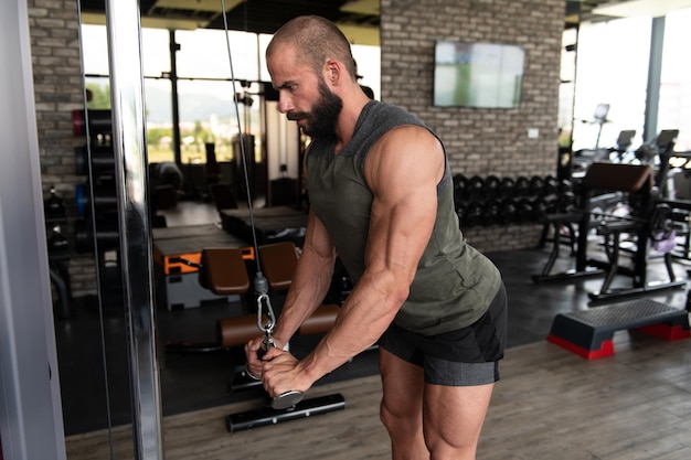 Man On Cable Machine Exercising Triceps