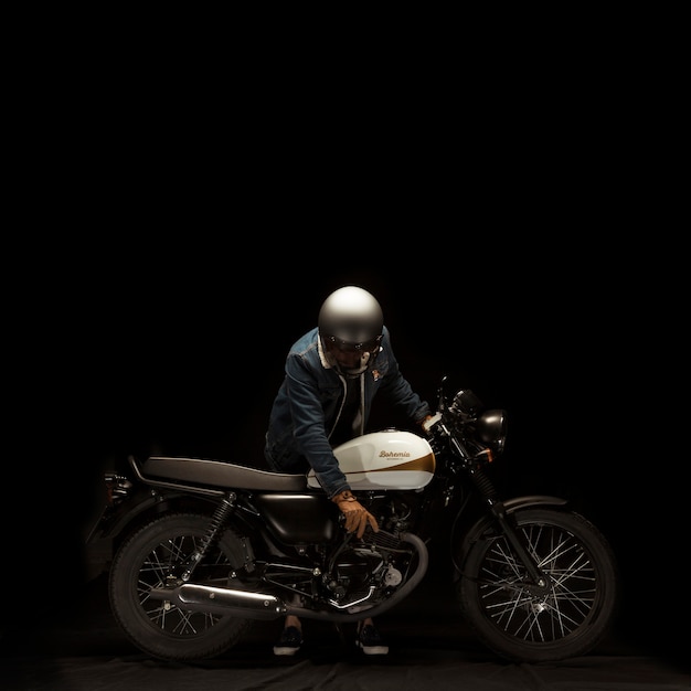 Man on cafe racer style motorbike