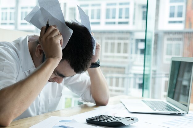 Man calculating domestic bills at home