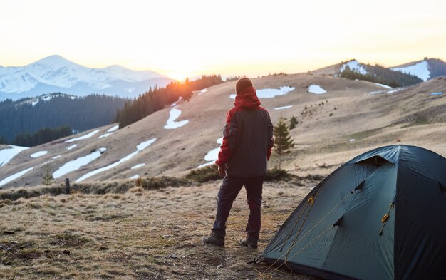 Man camping in the mountains