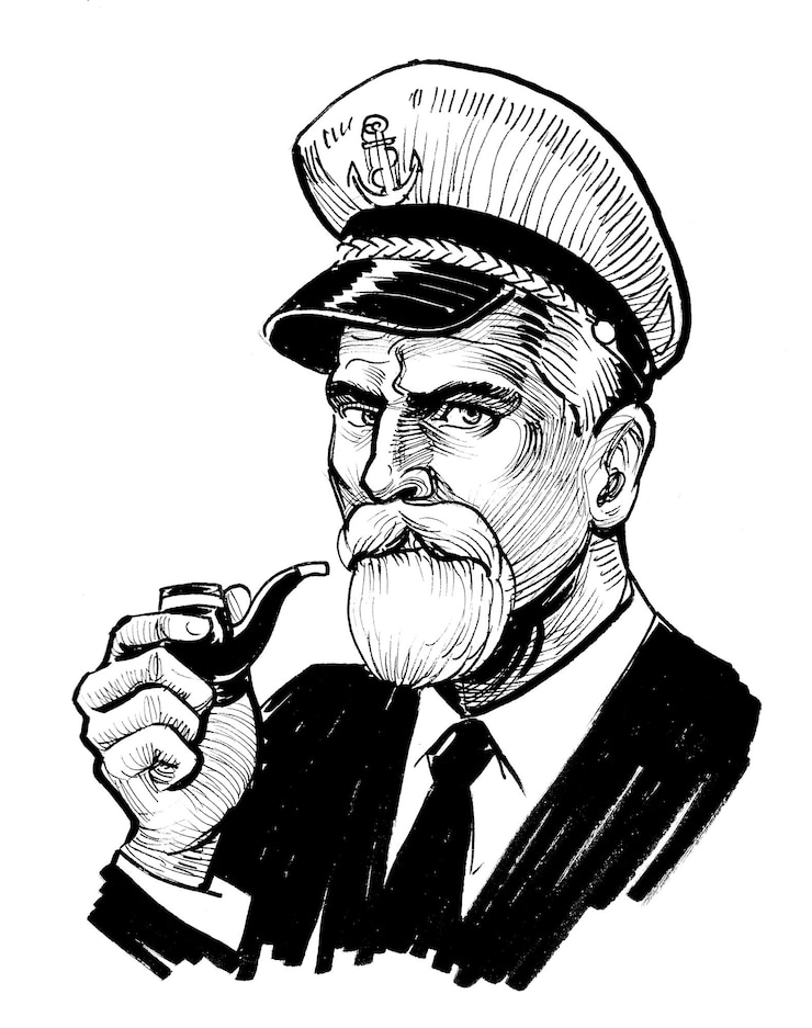 Photo a man in a captain hat smoking a pipe and wearing a cap.