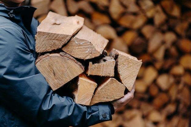 Man carries heap of wood